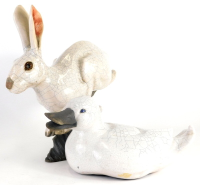 A Raku glazed Studio pottery hare, signed Brian Andrew, in running pose, crackle glaze, initialled beneath, 35cm high and a similar designed duck initialled SD. (2) - 3