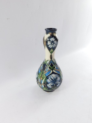 A Moorcroft pottery vase decorated in the Centaurea pattern, of double gourd form, initialled M C C, dated 2004-2005, No 496, painted and impressed marks, 23cm high. - 8