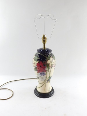 A Moorcroft pottery table lamp, of baluster form, decorated with mixed flowers against a cream ground, with shade, 67cm high. - 7