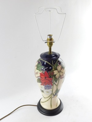 A Moorcroft pottery table lamp, of baluster form, decorated with mixed flowers against a cream ground, with shade, 67cm high. - 9