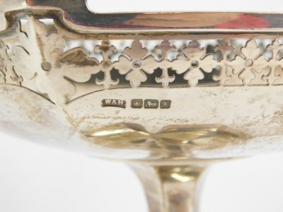 A George V pierced silver comport, the hexagonal top with raised and pierced shield border, on tapered base, Walker & Hall, Sheffield 1917, 20¼oz. - 10