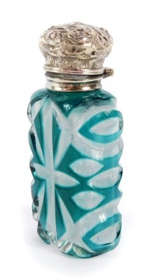 A Victorian flashed glass and silver topped scent bottle, the embossed silver hinged lid, with glass decanter stopper, and cut glass turquoise and clear glass body, hallmark rubbed, 10cm high. - 4
