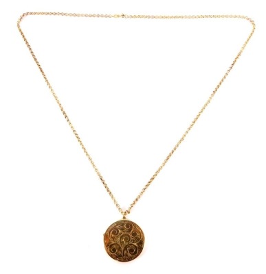 A 9ct gold pendant and chain, the circular floral engraved pendant opening to reveal locket interior, 3cm wide, on a 9ct gold curb link chain, 60cm long, 12.8g all in. - 6