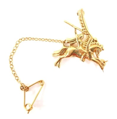 A 9ct gold Pegasus brooch, depicting Pegasus with warrior with flaming arrow, makers stamp BMG, London 1994, with single pin back and safety chain, 2.5cm wide, 4.5g all in. - 3