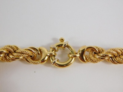 A fancy link bracelet, with layered brushed and plain links, with large circular clasp, yellow metal, marked 750, 19cm long, 18.3g all in. - 5