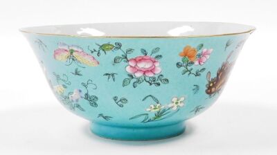 A 19thC Chinese porcelain bowl, the sgraffito turquoise ground incised with repeating scrolls and enamelled with polychromed butterflies, flora and fruits, 22cm diameter, 10cm high. (AF) - 11