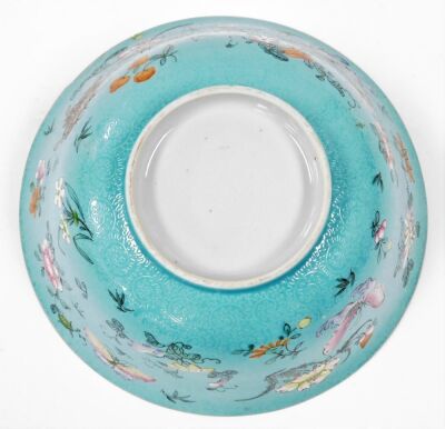 A 19thC Chinese porcelain bowl, the sgraffito turquoise ground incised with repeating scrolls and enamelled with polychromed butterflies, flora and fruits, 22cm diameter, 10cm high. (AF) - 13