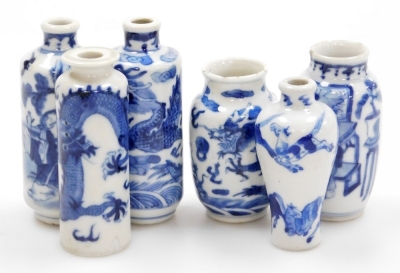 Three Chinese blue and white cylindrical porcelain snuff bottles, decorated with dragons, figures in a landscape, another of meiping form decorated with horses, and two further miniature blue and white vases; various Yongzheng and Qianlong marks to the un - 22