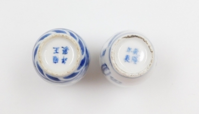 Three Chinese blue and white cylindrical porcelain snuff bottles, decorated with dragons, figures in a landscape, another of meiping form decorated with horses, and two further miniature blue and white vases; various Yongzheng and Qianlong marks to the un - 28