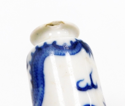 Three Chinese blue and white cylindrical porcelain snuff bottles, decorated with dragons, figures in a landscape, another of meiping form decorated with horses, and two further miniature blue and white vases; various Yongzheng and Qianlong marks to the un - 42