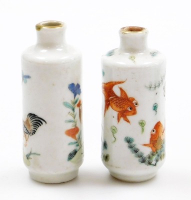 Two Chinese porcelain snuff bottles, decorated with Shubunkin and cockerels, 7.7cm and 8cm high, a small Chinese doucai bowl decorated with grasshoppers and flowers, 8cm high, a glass scent bottle and a small blue and white vase. (5) - 23