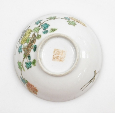 Two Chinese porcelain snuff bottles, decorated with Shubunkin and cockerels, 7.7cm and 8cm high, a small Chinese doucai bowl decorated with grasshoppers and flowers, 8cm high, a glass scent bottle and a small blue and white vase. (5) - 30