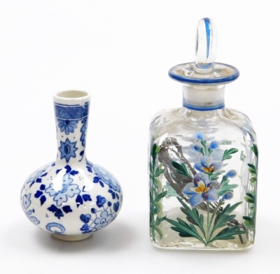 Two Chinese porcelain snuff bottles, decorated with Shubunkin and cockerels, 7.7cm and 8cm high, a small Chinese doucai bowl decorated with grasshoppers and flowers, 8cm high, a glass scent bottle and a small blue and white vase. (5) - 32