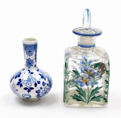 Two Chinese porcelain snuff bottles, decorated with Shubunkin and cockerels, 7.7cm and 8cm high, a small Chinese doucai bowl decorated with grasshoppers and flowers, 8cm high, a glass scent bottle and a small blue and white vase. (5) - 34