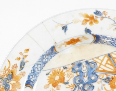 A collection of 18th Chinese plates, including four matching famille rose with chrysanthemum and swallow decoration, 23cm diameter, a pair with flowers and vases, 23cm diameter, and a Chinese Imari plate, 22.8cm diameter. (AF) - 22