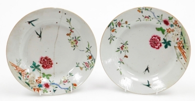 A collection of 18th Chinese plates, including four matching famille rose with chrysanthemum and swallow decoration, 23cm diameter, a pair with flowers and vases, 23cm diameter, and a Chinese Imari plate, 22.8cm diameter. (AF) - 23