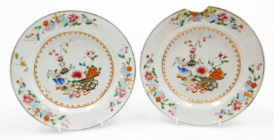 A collection of 18th Chinese plates, including four matching famille rose with chrysanthemum and swallow decoration, 23cm diameter, a pair with flowers and vases, 23cm diameter, and a Chinese Imari plate, 22.8cm diameter. (AF) - 29