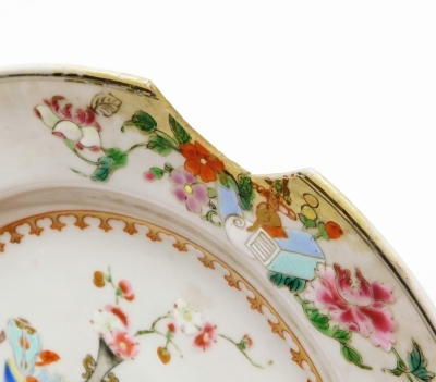 A collection of 18th Chinese plates, including four matching famille rose with chrysanthemum and swallow decoration, 23cm diameter, a pair with flowers and vases, 23cm diameter, and a Chinese Imari plate, 22.8cm diameter. (AF) - 31