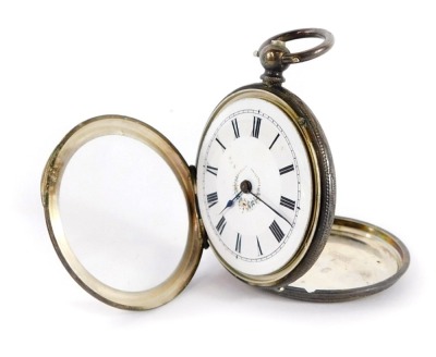 A continental lady's silver pocket watch, open faced, key wind, white enamel dial bearing Roman numerals, with central flower trail detailing, the outer casing with engraved floral and engine turned decoration, vacant shield reserve, with key, 42.2g all i - 5