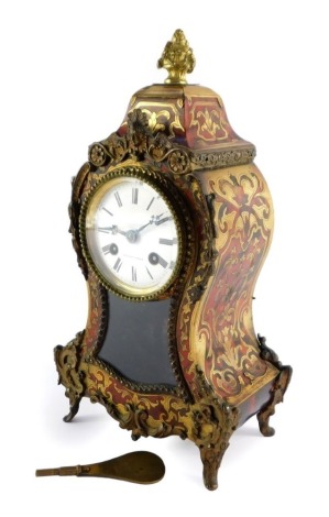 A French late 19thC Boulle mantel clock, the circular dial enamel dial signed Bright a Paris, and bearing Roman numerals, with Japy eight day movement striking on a bell, the case of balloon form, with pendulum and key, 31cm high, 16cm wide, 9cm deep.