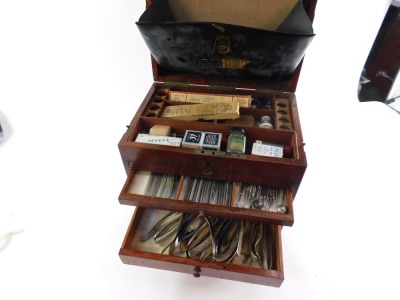 A Victorian mahogany dentist's chest by C Ash Sons & Company Ltd, London, the hinged lid with brass carrying handle, opening to reveal a fitted interior, with ointments and sundries, above five graduated drawers containing various instruments, 35cm high, - 2