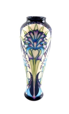 A Moorcroft pottery vase, c2005, designed by Sian Leeper, limited edition 50/50, decorated with elongated stylized flowers, painted and impressed numbers, 26.5cm high.