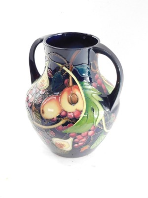 A Moorcroft pottery vase decorated in the Queen's Choice pattern, of Portland vase form, c2000, painted and impressed marks, 26cm high. - 2