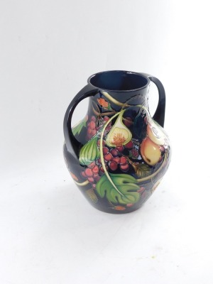 A Moorcroft pottery vase decorated in the Queen's Choice pattern, of Portland vase form, c2000, painted and impressed marks, 26cm high. - 3