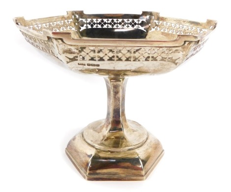 A George V pierced silver comport, the hexagonal top with raised and pierced shield border, on tapered base, Walker & Hall, Sheffield 1917, 20¼oz.