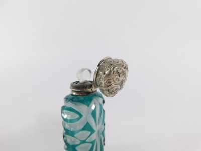 A Victorian flashed glass and silver topped scent bottle, the embossed silver hinged lid, with glass decanter stopper, and cut glass turquoise and clear glass body, hallmark rubbed, 10cm high. - 3