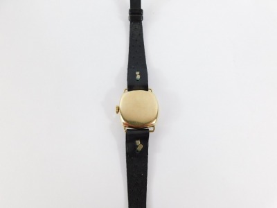 A Rotary 9ct gold lady's wristwatch, with square watch head and circular dial with seconds dial and silvered chequed backing, 2cm wide, on a black leather strap, 13g all in. - 3