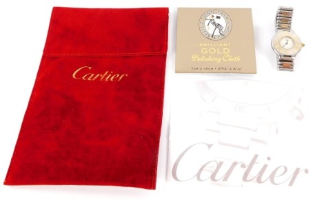 A Must de Cartier lady's stainless steel cased wristwatch, with white dial, bearing outer Roman numeral dial ring, with blue handles and a cabochon set winder, on a bi-colour two row strap, numbered 901004905, watch head 2.5cm wide, 59.7g all in, in red C