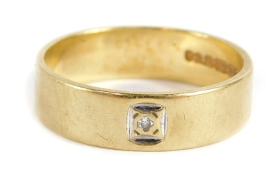 A 9ct gold wedding band, set with tiny diamond in white gold square setting, London 1986, ring size M½, 3g all in.