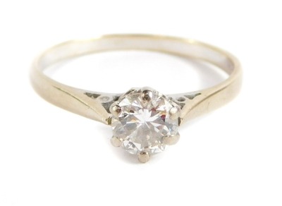 An 18ct white gold diamond solitaire ring, with round brilliant cut diamond approx 0.30cts, in six claw setting, with pierced sides, ring size N, 2.4g all in.