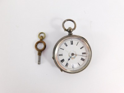 A continental lady's silver pocket watch, open faced, key wind, white enamel dial bearing Roman numerals, with central flower trail detailing, the outer casing with engraved floral and engine turned decoration, vacant shield reserve, with key, 42.2g all i - 2