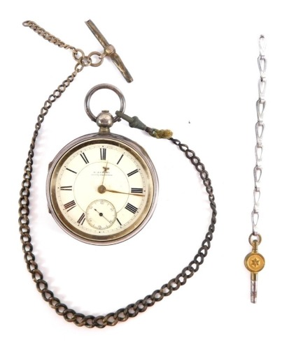 A Victorian gentleman's silver pocket watch, by H Samuel of Manchester, open faced, key wind, white enamel dial bearing Roman numerals, and gold coloured hands, the case with engine turned decoration, shield and garter reserves, with key, Chester 1897 145