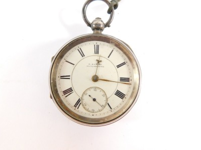 A Victorian gentleman's silver pocket watch, by H Samuel of Manchester, open faced, key wind, white enamel dial bearing Roman numerals, and gold coloured hands, the case with engine turned decoration, shield and garter reserves, with key, Chester 1897 145 - 3