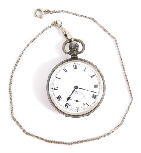 A George V silver gentleman's pocket watch, open faced, keyless wind, white enamel dial bearing Roman numerals, subsidiary seconds dial, blue hands, the case with engine turned decoration, shield and garter reserve, Birmingham 1930, on a silver plated wat