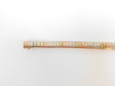 A tri-colour bracelet, with bark effect detailing and cross sections, with clip in clasp, yellow metal, marked 9kt, 19cm long, 9.2g. - 3