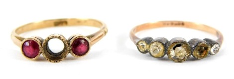 Two dress rings, a 9ct gold three stone set dress ring, set with garnets, central stone missing, and a 9ct gold and silver paste stone set dress ring, 3.5g all in. (AF)