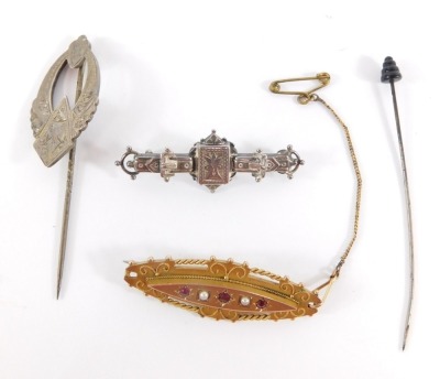 A group of Victorian and later bar brooches, a 9ct gold Victorian C and Co garnet and seed pearl set brooch, with safety chain, 5cm wide, 6g, a Victorian silver buckle bar brooch, 4.5cm wide, and a silver scarf pin, 7cm high, 6.4g, together with a hat pin