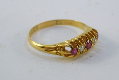 An 18ct gold ruby and diamond ring, the gypsy setting set with three rubies and two diamonds, in claw setting, 2.3g all in. - 4