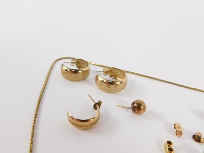 A group of jewellery, comprising a pair of 9ct gold hoop earrings, various 9ct gold and other studs, a pair of flower studs, a gold plated locket, 9ct gold bar brooch, and a gold plated chain, weighable yellow metal 6.5g all in. - 2