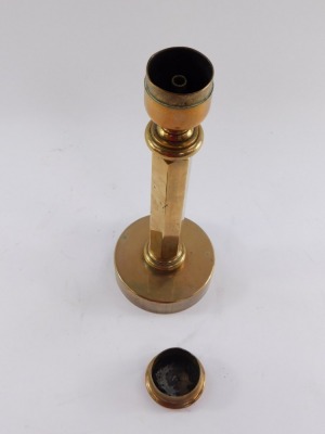 An early 20thC solid brass candlestick, with snuffer lid, 32.5cm high. - 2