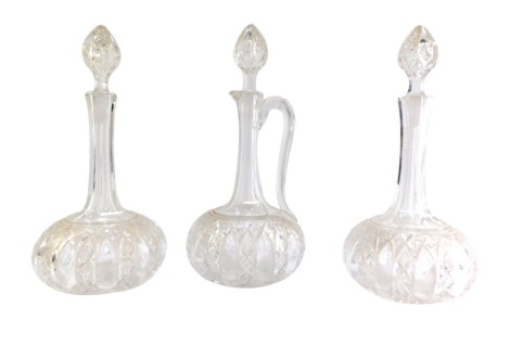 A pair of Victorian cut glass decanters and stoppers, 29.5cm high, together with a matching claret jug, 31cm high. (3)