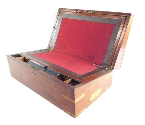 A Victorian mahogany and brass bound writing slope, of rectangular section. opening to reveal a fitted interior, 16cm x 46.5cm x 26cm.