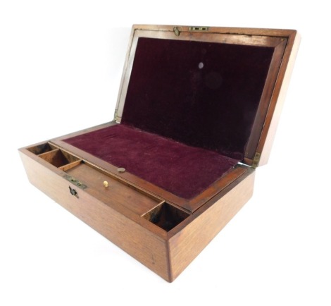 A Victorian mahogany writing slope, with vacant brass plate to the lid, opening to reveal a fitted interior, 13cm x 40.5cm x 24.5cm.