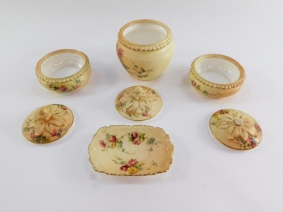 A Royal Worcester blush porcelain part dressing table set, c1911, painted with meadow flowers, printed marks, comprising three circular jars and covers and a pin dish. (4, AF) - 2