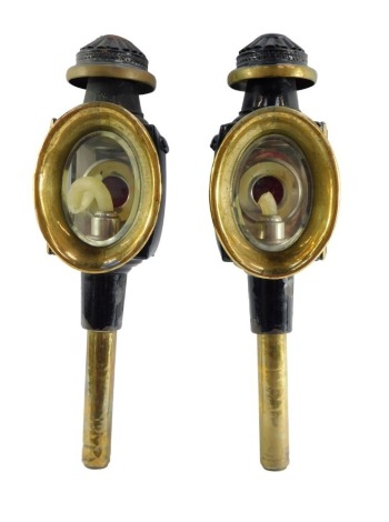 A pair of Victorian brass and black enamelled carriage lanterns, 47cm high.