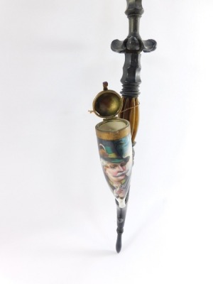 A Tyrolean late 19thC horn and porcelain pipe, painted with the figure of a hunter, 63cm wide. - 2